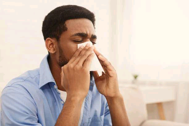 African-American-man-sneezing-Photo-iStock